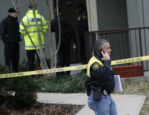 Grapevine police investigate the scene where they found seven people dead outside Dallas in Grapevine, Texas, Sunday, Dec. 25, 2011.(AP)