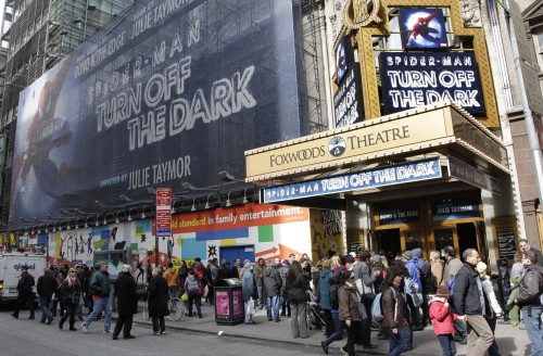 This file photo shows people line up to enter the Foxwoods Theatre for a matinee showing of "Spider-Man: Turn Off the Dark," in New York. (AP)