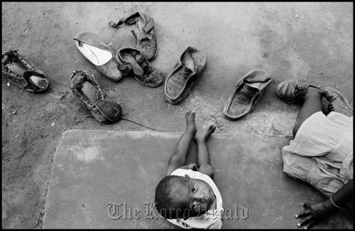 Swazi boy Tenele looks up at the camera in a photo taken by Larry Towell in 2007. Larry Towell/Magnum Photos/Eurocreon