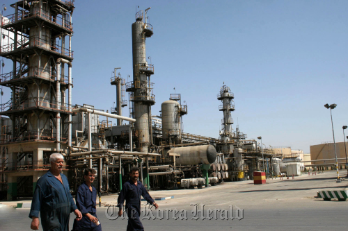 Workers seen at Tehran’s main oil refinery south of Tehran, Iran.  Bloomberg