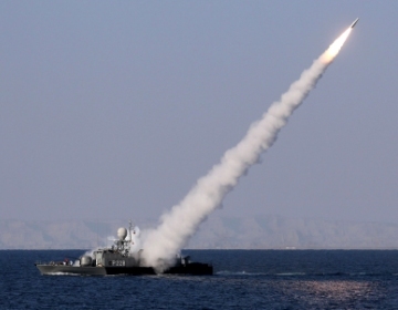 An Iranian warship launches a missile during Iranian naval maneuvers dubbed Velayat 90 on the Sea of Oman, Iran, Jan. 1. (Xinhua)