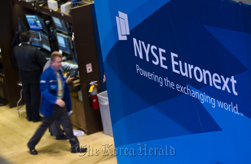 Traders work on the floor of the New York Stock Exchange in New York.  Bloomberg
Traders work on the floor of the New York Stock Exchange in New York.  Bloomberg
