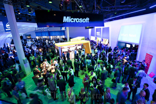 Attendees browse products at the Microsoft Corp. booth during the 2012 International Consumer Electronics Show in Las Vegas.  Bloomberg