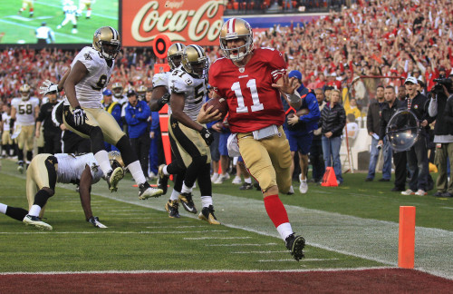 <YONHAP PHOTO-0597> San Francisco 49ers quarterback Alex Smith (11) crosses the goal line for a touchdown against the New Orleans Saints in the fourth quarter of an NFL divisional playoff football game Saturday, Jan. 14, 2012, in San Francisco. (AP Photo/Marcio Jose Sanchez)/2012-01-15 10:38:05/ <저작권자 ⓒ 1980-2012 ㈜연합뉴스. 무단 전재 재배포 금지.>
San Francisco 49ers quarterback Alex Smith scores a touchdown in the fourth quarter.  AP-Yonhap News
San Francisco 49ers quarterback Alex Smith scores a touchdown in the fourth quarter.  AP-Yonhap News