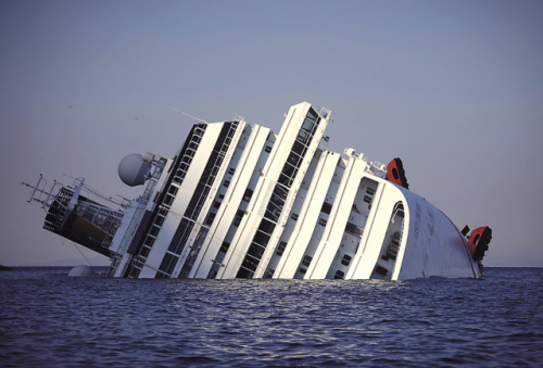 View of the Costa Concordia taken on saturday after the cruise ship ran aground and keeled over off the isola del giglio, italy. (AFP-Yonhap News)
A passenger (front center) from Korea walks with italian firefighters after being rescued from the luxury cruise ship Costa Concordia, which ran aground the tiny Tuscan island of giglio, italy, sunday. (AP-Yonhap News)