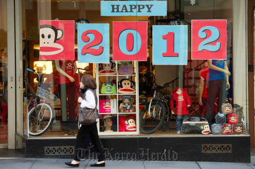 A pedestrian passes in front of a Paul Frank Industries LLC store in San Francisco, California.  Bloomberg