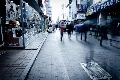 Shoppers walk along a shopping district in Gwangju. Joe Wabe