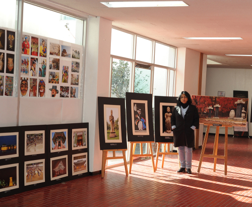 Sampa Guhamajumdar poses with her exhibition photos. Sampa Guhamajumdar