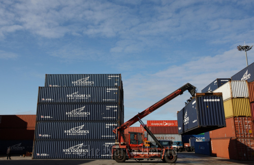 A straddle carrier moves a container at the Uiwang Inland Container Depot.  Bloomberg