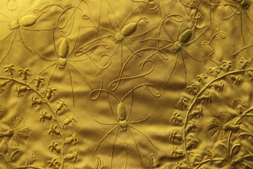 <YONHAP PHOTO-1317> Details are seen of a spider silk cape, designed by Simon Peers and Nicholas Godley, on display at the Victoria and Albert Museum in London, Tuesday, Jan. 24, 2012. The cape is woven and embroidered in Madagascar and is made from the silk of more than a million female Golden Orb Weaver spiders collected in the highlands of Madagascar. The hand-woven textile is naturally golden in colour and took over four years to create. (AP Photo/Sang Tan)/2012-01-24 22:52:32/ <저작권자 ⓒ 1980-2012 ㈜연합뉴스. 무단 전재 재배포 금지.>
Details of a spider silk cape designed by Simon Peers and Nicholas Godley are seen on display at the Victoria and Albert Museum in London, Tuesday.
AP-Yonhap News