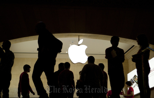 Employees walk through the new Apple retail location in Grand Central Terminal in New York.  Bloomberg