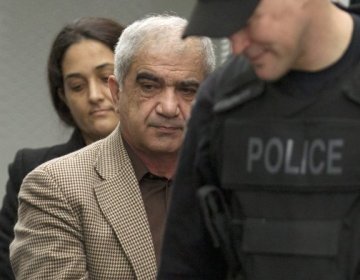 Mohammad Shafia, front, and Tooba Yahya are escorted into the Frontenac County courthouse in Kingston, Ontario, Canada on Friday. (AP)