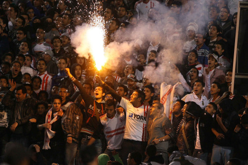 <YONHAP PHOTO-0762> (120201) -- CAIRO, Feb. 1, 2012 (Xinhua) -- Football fans set up fireworks at Cairo International Stadium on Feb. 1, 2012. The second half of a football match at Cairo International Stadium was cancelled due to the riot during football match in Port Said. The death toll from a football riot in Egypt's Port Said rose to 73, state TV reported on Wednesday night.(Xinhua/Ayman Mose)/2012-02-02 06:59:05/ <저작권자 ⓒ 1980-2012 ㈜연합뉴스. 무단 전재 재배포 금지.>
Football fans set up fireworks at Cairo International Stadium on Wednesday.       Xinhua-Yonhap News
