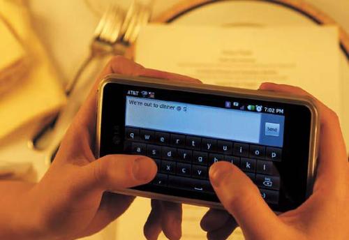 A few restaurants try to discourage the use of cellphones, but
the rise of the smartphone, with its multiple functions, has made
accommodation more practical for some restaurant owners.
(Los Angeles Times/MCT)