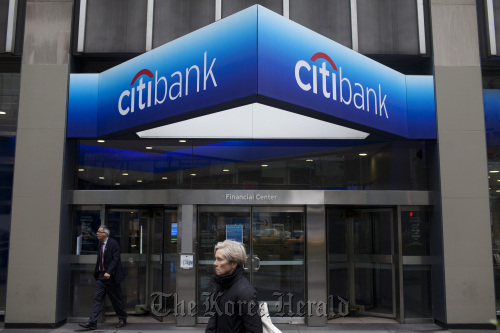 Pedestrians walk past Citigroup Inc. offices in New York.  Bloomberg