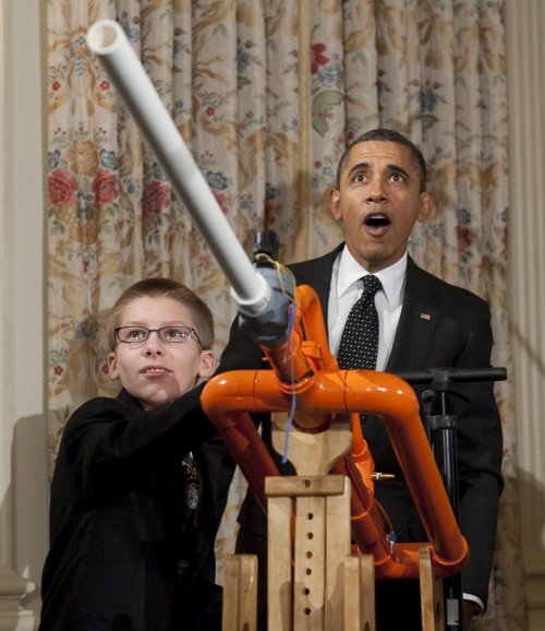 <YONHAP PHOTO-0164> US President Barack Obama reacts as 14-year-old Joey Hudy of Phoenix, Arizona, launches a marshmallow from Hudy's "Extreme Marshmallow Cannon" during a tour of the White House Science Fair in the State Dining Room of the White House in Washington, DC, February 7, 2012. Obama announced new policies to recruit and support science, technology, engineering and math (STEM) teacher programs, including requesting $80 million in his upcoming budget for teacher preparation, with the goal of training one million additional STEM students over the next decade. AFP PHOTO / Saul LOEB../2012-02-08 02:23:59/ <저작권자 ⓒ 1980-2012 ㈜연합뉴스. 무단 전재 재배포 금지.>\r\n<YONHAP PHOTO-0164> US President Barack Obama reacts as 14-year-old Joey Hudy of Phoenix, Arizona, launches a marshmallow from Hudy's "Extreme Marshmallow Cannon" during a tour of the White House Science Fair in the State Dining Room of the White House in Washington, DC, February 7, 2012. Obama announced new policies to recruit and support science, technology, engineering and math (STEM) teacher programs, including requesting $80 million in his upcoming budget for teacher preparation, with the goal of training one million additional STEM students over the next decade. AFP PHOTO / Saul LOEB../2012-02-08 02:23:59/ <저작권자 ⓒ 1980-2012 ㈜연합뉴스. 무단 전재 재배포 금지.>