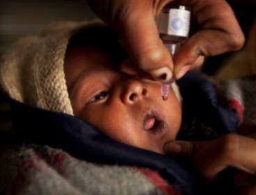 A newborn baby is being given a medication in India, Jan. 13. (AP)