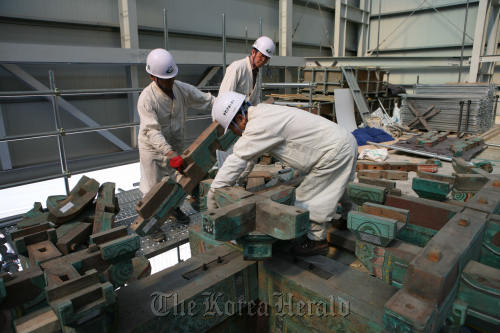 Experts work at the restoration site of Namdaemun.  Cultural Heritage Administration