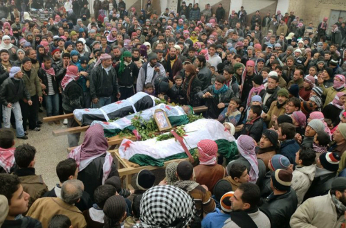 <YONHAP PHOTO-1598> in this undated citizen journalism image provided by the Local Coordination Committees in Syria and accessed on Wednesday, Feb. 8, 2012, mourners gather around the bodies of people allegedly killed by Syrian government forces, during a funeral procession in Maarat al-Noman, Idlib province, Syria. (AP Photo/Local Coordination Committees in Syria) THE ASSOCIATED PRESS IS UNABLE TO INDEPENDENTLY VERIFY THE AUTHENTICITY, CONTENT, LOCATION OR DATE OF THIS HANDOUT PHOTO/2012-02-08 19:43:38/ <저작권자 ⓒ 1980-2012 ㈜연합뉴스. 무단 전재 재배포 금지.>
Mourners gather around the bodies of people allegedly killed by government forces, during a funeral procession in Maarat al-Noman, Idlib province, Syria on Wednesday.  AP-Yonhap News