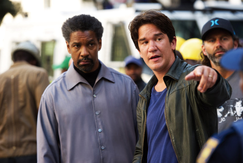 Denzel Washington (left) and director Daniel Espinosa on the set of the action-thriller, “Safe House” (Universal Pictures/MCTeye)