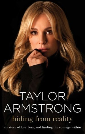 In this 2011 file photograph, Russell Armstrong (left) and estranged wife Taylor Armstrong, pose for a portrait in Los Angeles, California. Abaca Press/MCT
Armstrong’s book, “Hiding From Reality.”