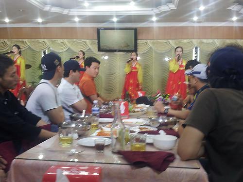 Song and dance performance during dinner at Pyeongyang Restaurant      Yonhap News