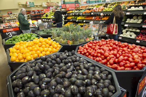 Customers shop for produce at a Wal-Mart Stores Inc. location in American Canyon, California.  Bloomberg