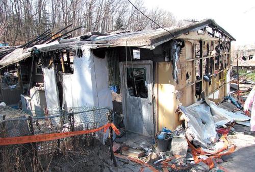 A house destroyed by a recent fire in Guryong. (Kirsty Taylor)