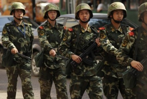 Chinese paramilitary police patrol on the streets of Urumqi -- the capital of China's Xinjiang region -- in July 2010. (AFP)