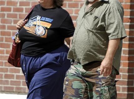 In this July 7, 2011 file photo, people walk on the street in Montpelier, Vermont. The battle of the bulge so far has been a big, fat failure for U.S. drugmakers. (AP)
