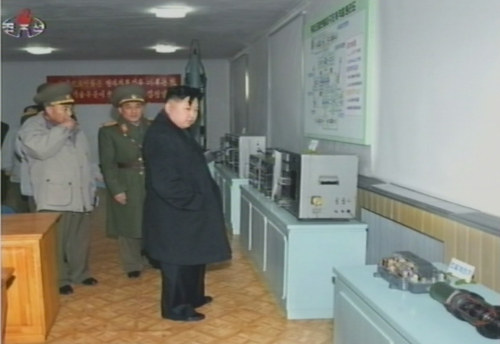 North Korean leader Kim Jong-un (right) inspects a missile command unit on Friday. (Yonhap News)
