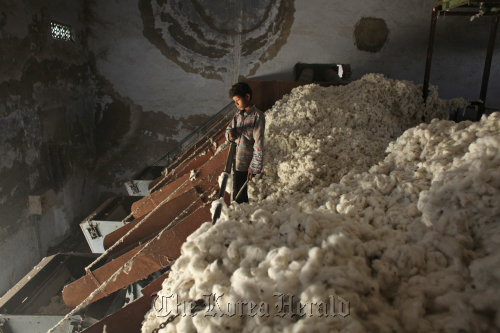 A boy works in a ginning mill in Wankaner, India.  Bloomberg