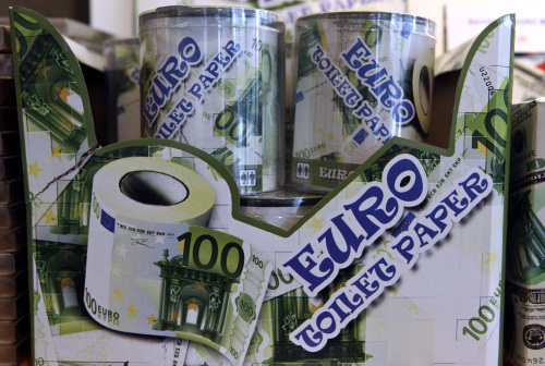 Tins of toilet tissue, printed in the style of a 100 euro note, sit for sale in a souvenir store in Frankfurt, Germany, on Wednesday, Feb. 29, 2012. Euro-area banks tapped the European Central Bank for a record amount of three-year cash in an operation that may boost bond and equity markets. Photographer: Hannelore Foerster/Bloomberg
Tins of toilet tissue, printed in the style of a 100 euro note, sit for sale in a souvenir store in Frankfurt.
Bloomberg
