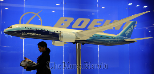 A model of a Boeing Co. 787 Dreamliner stands on display at the Singapore Airshow in Singapore.  Bloomberg