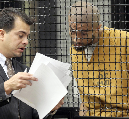 Itzcoatl Ocampo confers with his attorney Randall Longwith during Ocampo's arraignment Tuesday Feb. 21 in Santa Ana, California. (AP-Yonhap News)