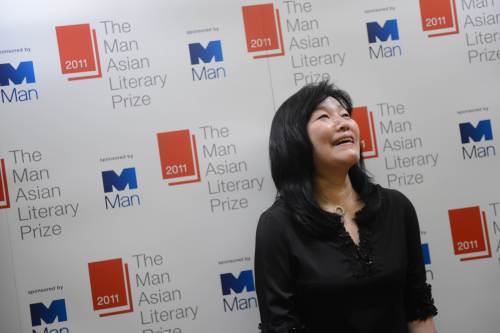 <YONHAP PHOTO-0058> South Korean author Kyung-sook Shin laughs during a photo call after she won the Man Asian Literary Prize for her book, Please Look After Mom, in Hong Kong on March 15, 2012. Author Kyung-sook Shin won Asia's most prestigious prize for literature for her novel about a family's guilty soul-searching after the disappearance of their elderly mother. AFP PHOTO / AARON TAM../2012-03-16 01:05:11/ <저작권자 ⓒ 1980-2012 ㈜연합뉴스. 무단 전재 재배포 금지.>
South Korean author Shin Kyung-sook laughs after winning the Man Asian Literary Prize for her book “Please Look After Mom” in Hong Kong on Mar. 15.  AFP