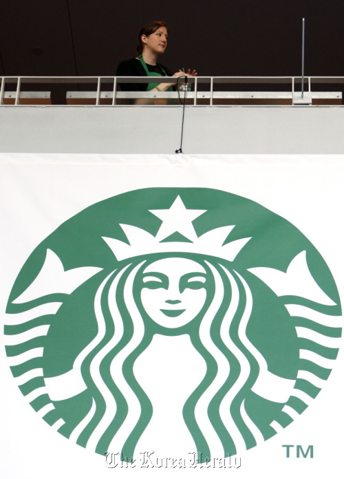 Starbucks Corp. signage is displayed in Seattle, Washington.   Bloomberg
