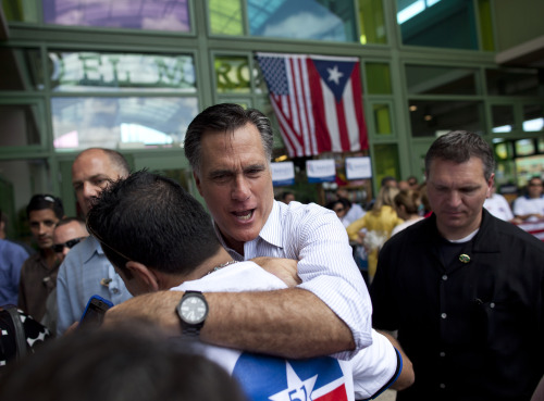 <YONHAP PHOTO-0343> Republican presidential candidate, former Massachusetts Gov. Mitt Romney, hugs a supporter during a campaign stop on Saturday, March 17, 2012, in Bayamon, Puerto Rico. (AP Photo/Evan Vucci)/2012-03-18 05:30:54/ <저작권자 ⓒ 1980-2012 ㈜연합뉴스. 무단 전재 재배포 금지.>
Republican presidential candidate, former Massachusetts Gov. Mitt Romney, hugs a supporter during a campaign stop in Bayamon, Puerto Rico on Saturday.  AP-Yonhap News