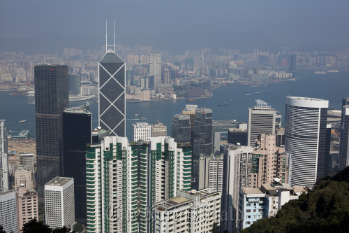Commercial buildings rise above the business district of Central in Hong Kong.  Bloomberg
Commercial buildings rise above the business district of Central in Hong Kong.  Bloomberg
