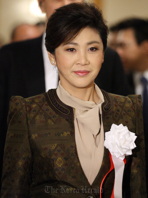 Yingluck Shinawatra, Thailand's prime minister, arrives for an investment seminar in Tokyo, Japan, on Wednesday, March 7, 2012. Shinawatra said that she expects the nation's economy to have a strong rebound with growth of between 5.5 percent and 6.5 percent this year. Photographer: Tomohiro Ohsumi/Bloomberg *** Local Caption *** Yingluck Shinawatra
Yingluck Shinawatra
Yingluck Shinawatra