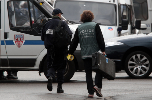 French polices officers arrive near a building where the chief suspect in an al-Qaida-linked killing spree is holed up in an apartment in Toulouse, France Thursday March 22, 2012. (AP)