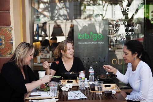 Customers eat bibimbap at a Bibigo restaurant in Los Angeles.    CJ Foodville