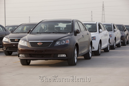 Geely Automobile Holdings Ltd. Emgrand 7 series automobiles are parked at the company’s factory in Cixi, Zhejiang Province, China.  Bloomberg