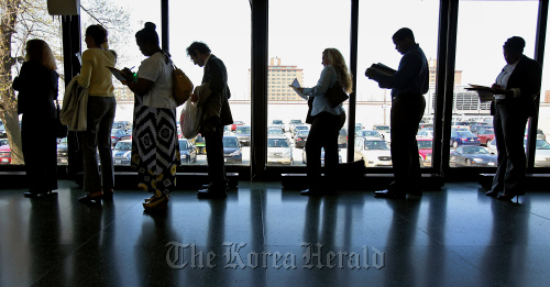 Job seekers stand in a line at the 12th Annual Diversity Employment Day Career Fair in Chicago.  Bloomberg