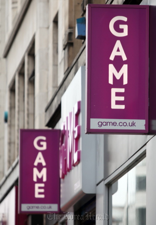 A sign hangs outside a branch of Game Group Plc, on Oxford Street in London.  Bloomberg