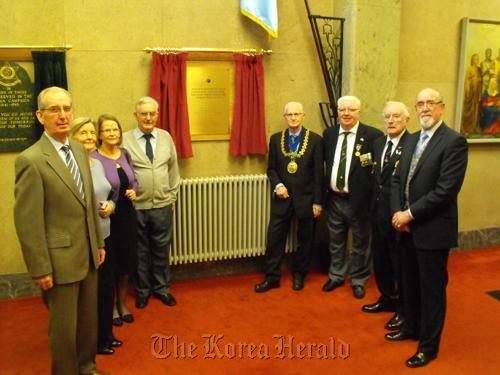 Jim Devlin (third from right) and Bill Fyffe (to Devlin’s right) at the plaque’s unveiling with Dundee’s lord provost, John Letford (fourth from right).         Dundee city government