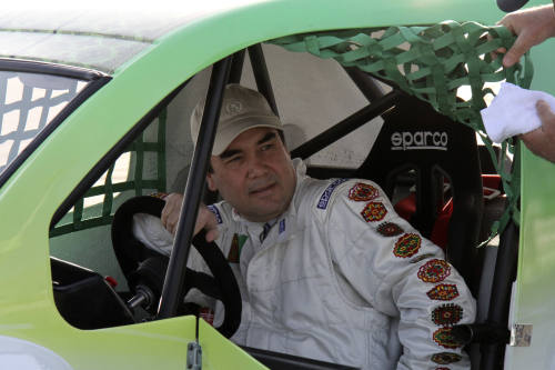 Turkmenistan's President Gurbanguli Berdymukhamedov sits in a Volkicar after winning a car race in Ashgabat, Turkmenistan, Saturday. (AP-Yonhap News)