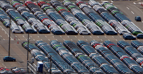 Mazda Motor Corp. cars bound for shipment sit at the company’s Ujina plant in Hiroshima.  Bloomberg