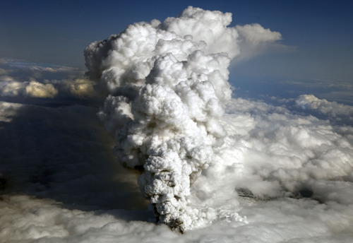 An aerial photo shows smoke rising from the volcano under a glacier in the Eyjafjallajokull region of Iceland, on April 14, 2010. (Bloomberg)