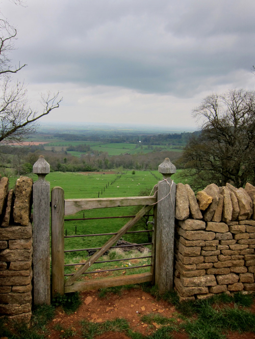 Walkers through England’s Cotswolds pass through gates in the region’s stone walls. (Los Angeles Times/MCT)
